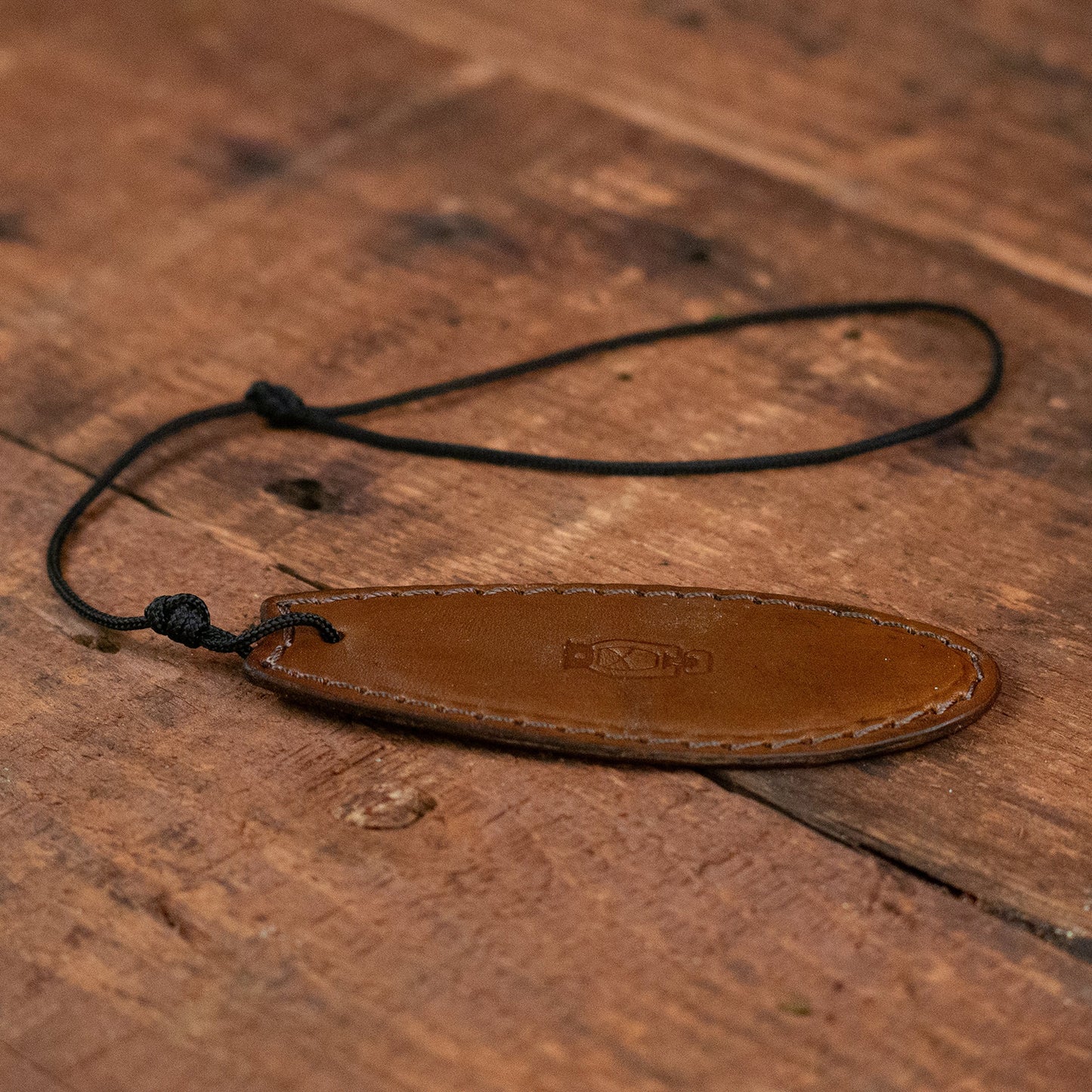 Detail shot of Finger Surfboard by Dark Forest in Walnut Leather