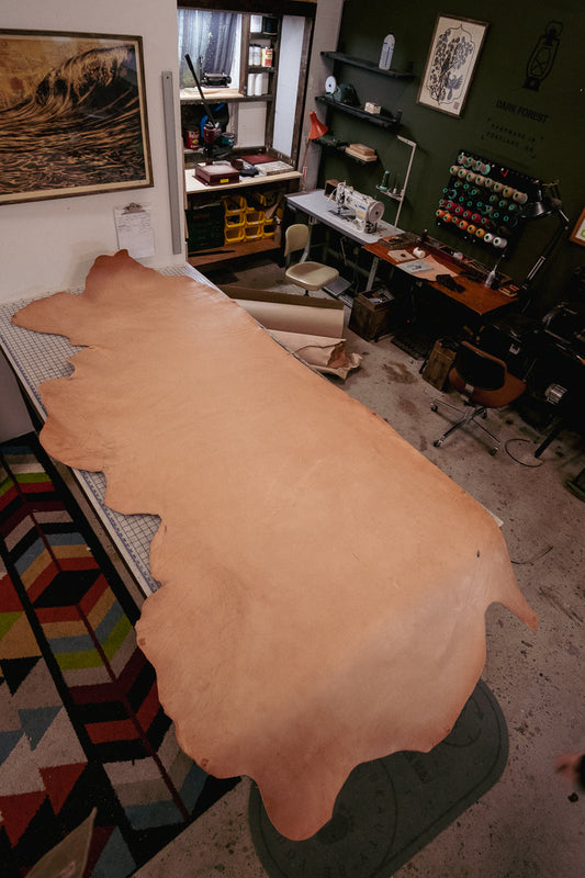 Why does vegetable-tanned leather change color?