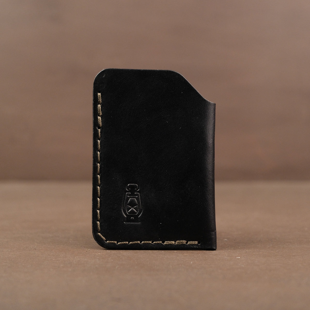Black minimalist full grain leather card wallet made in usa with veg tan leather