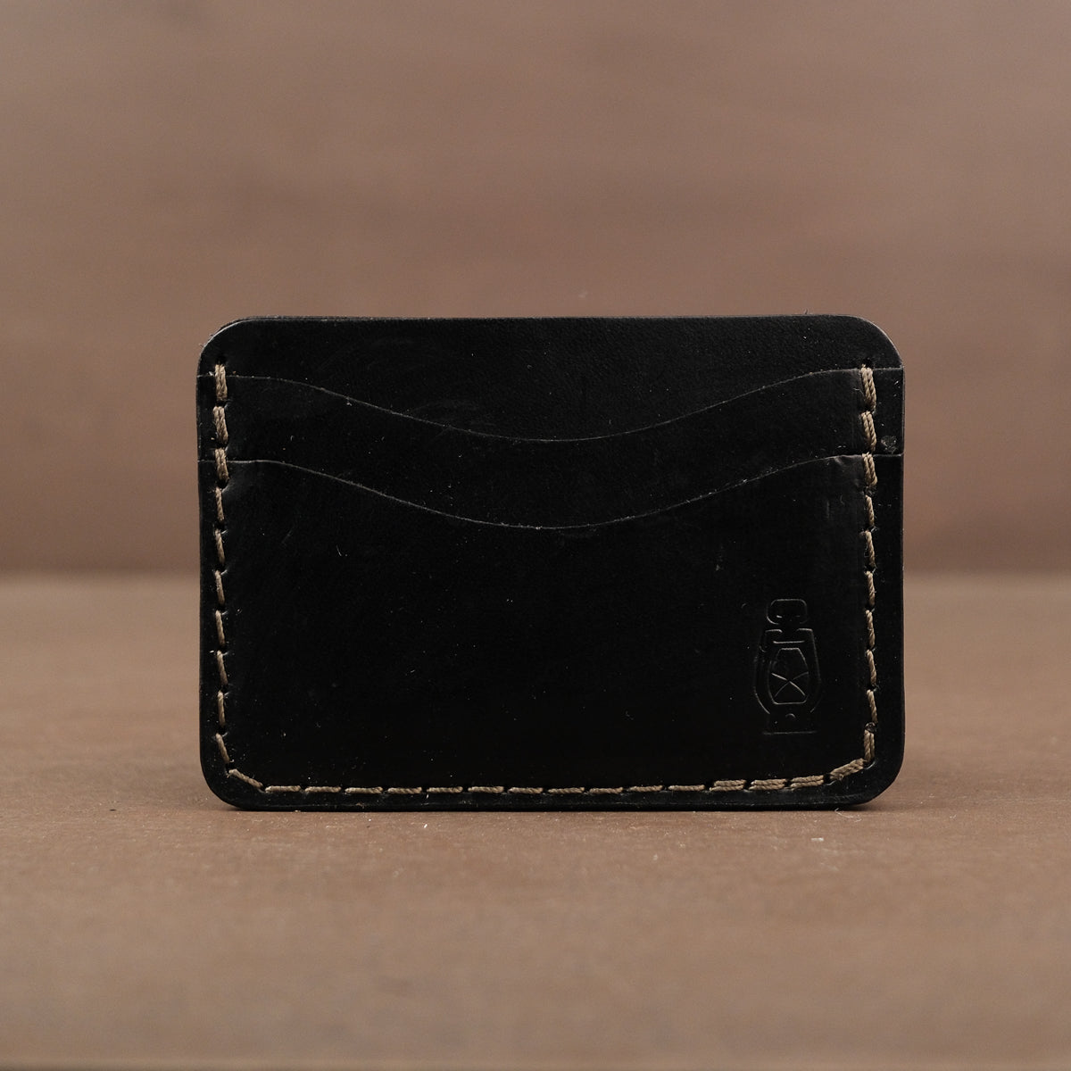 Black card wallet made from full grain veg tan leather