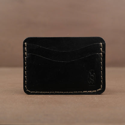 Black card wallet made from full grain veg tan leather