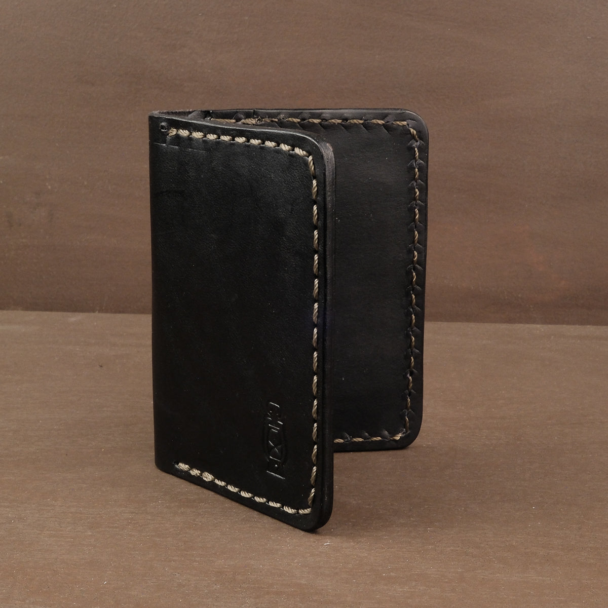 Black vertical leather wallet  made from full grain leather in Portland OR