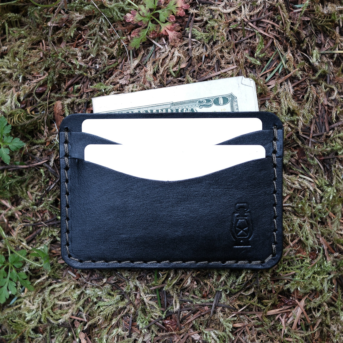 Black card wallet made from full grain veg tan leather