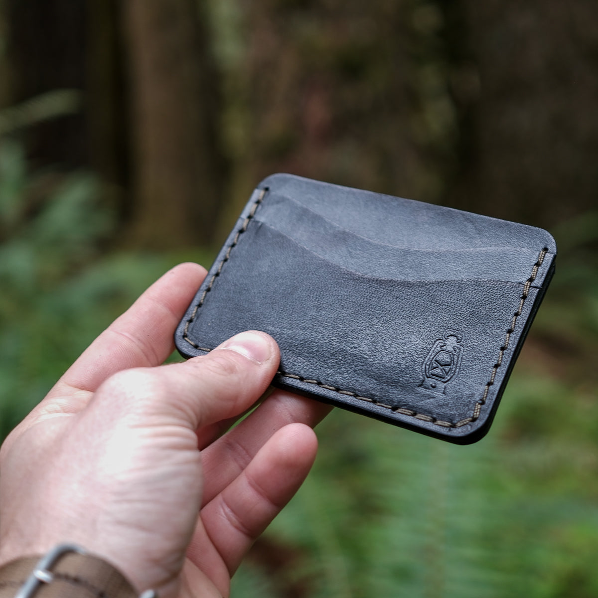 Black card wallet made from full grain veg tan leather