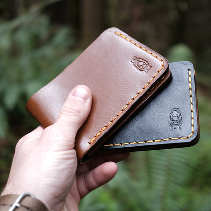 Handcrafted leather bifold wallets made from full grain veg tan leather