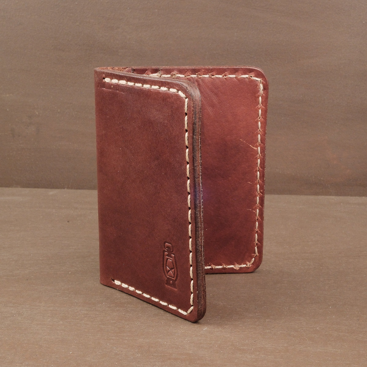 Mahogany leather wallet in vertical format made like they used to make em