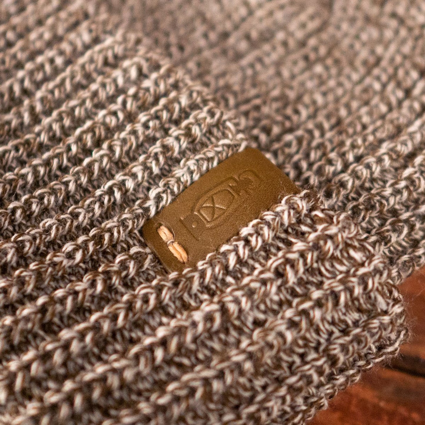 Leather accent on the Marl Watch Cap by Dark Forest