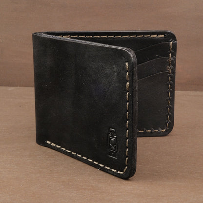Black Wrangler bifold wallet made from full grain leather, handcrafted in the USA with vegetable tanned Herman Oak leather